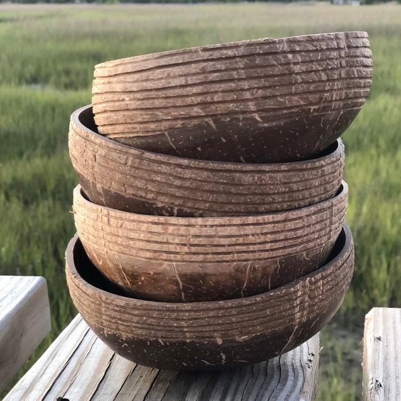 coconut bowls piled on a table ready to serve food