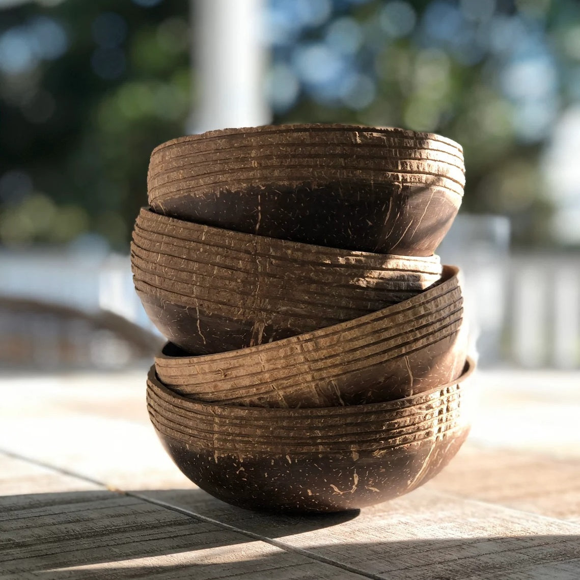 coconut bowls piled on a table ready to serve food